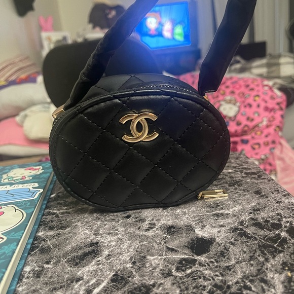 CHANEL Oval Black Quilted Mini Bag with Gold Accent - Picture 1 of 8